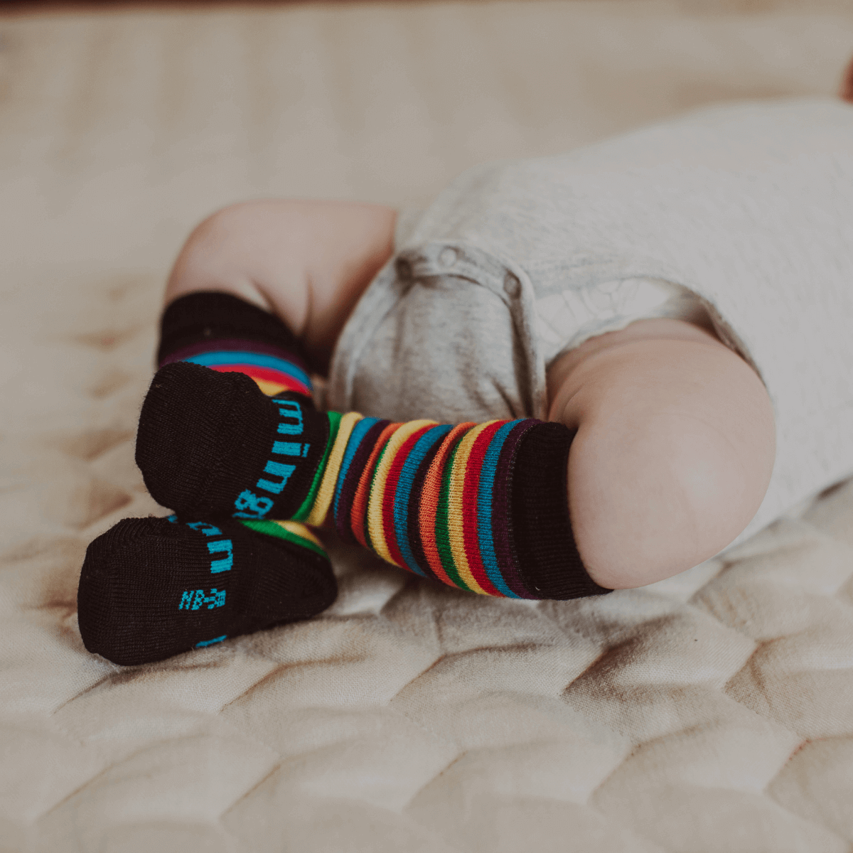 baby wearing merino knee-high socks au rainbow