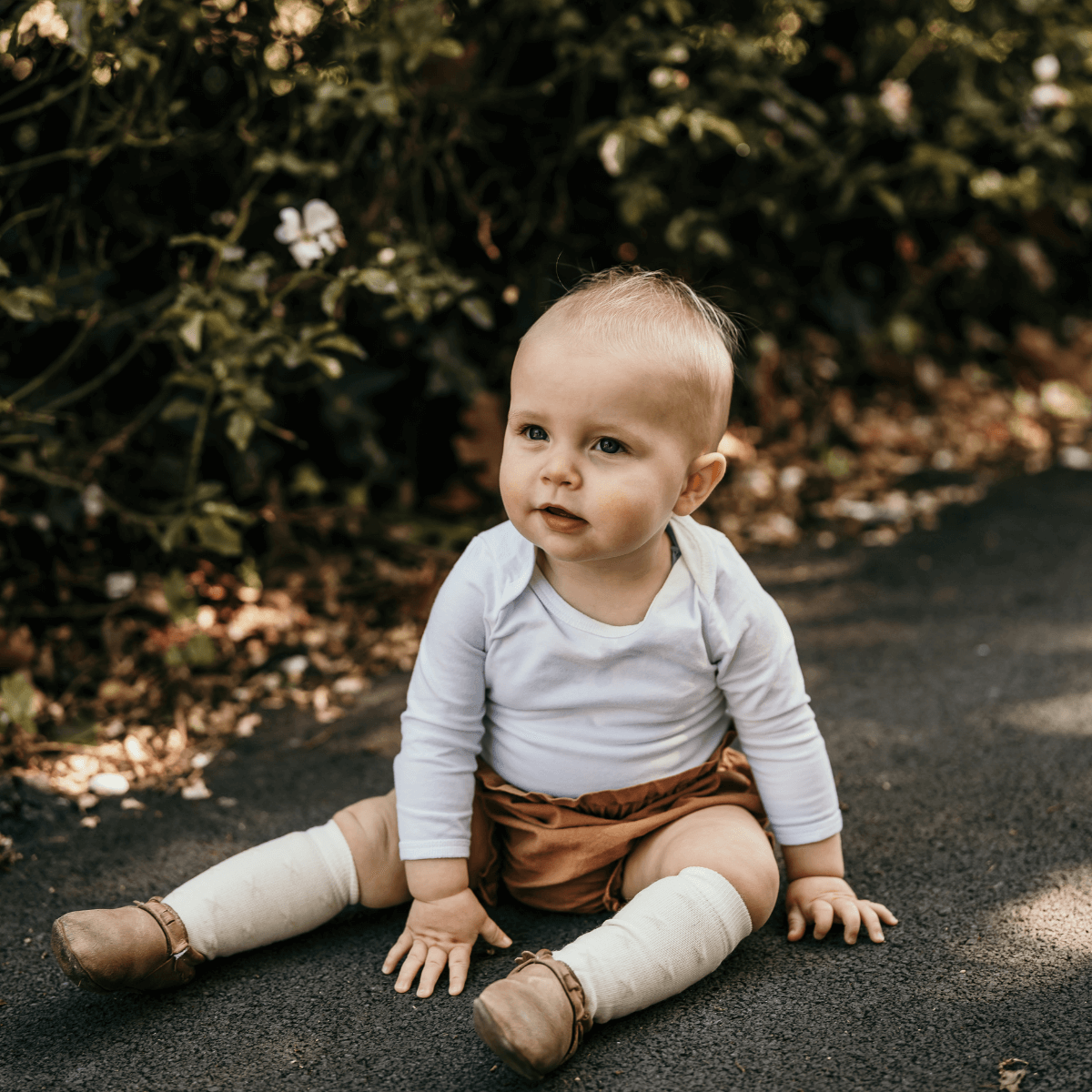 baby wearing merino wool knee-high socks cream with oatmeal crosses aus