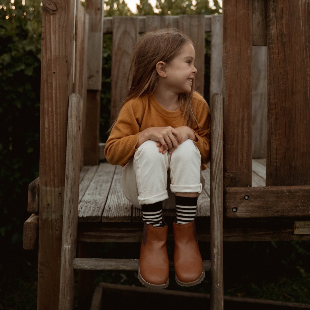 Merino Wool Crew Socks for Child in black with latte horizontal stripes, perfect for warmth and style.