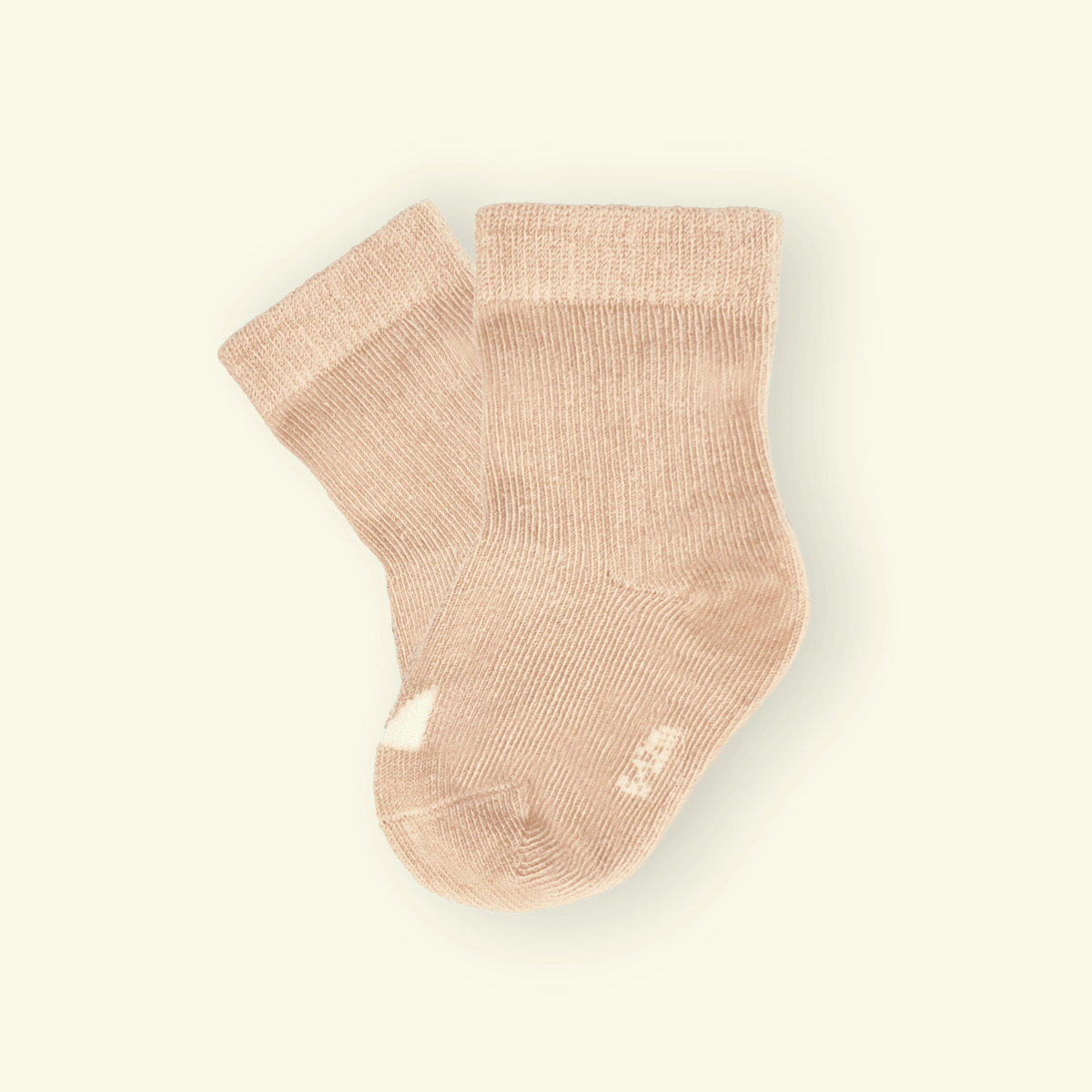 Organic Cotton Baby Socks in Oatmeal color, soft and snug for little feet, featuring Mosey logo above toes.