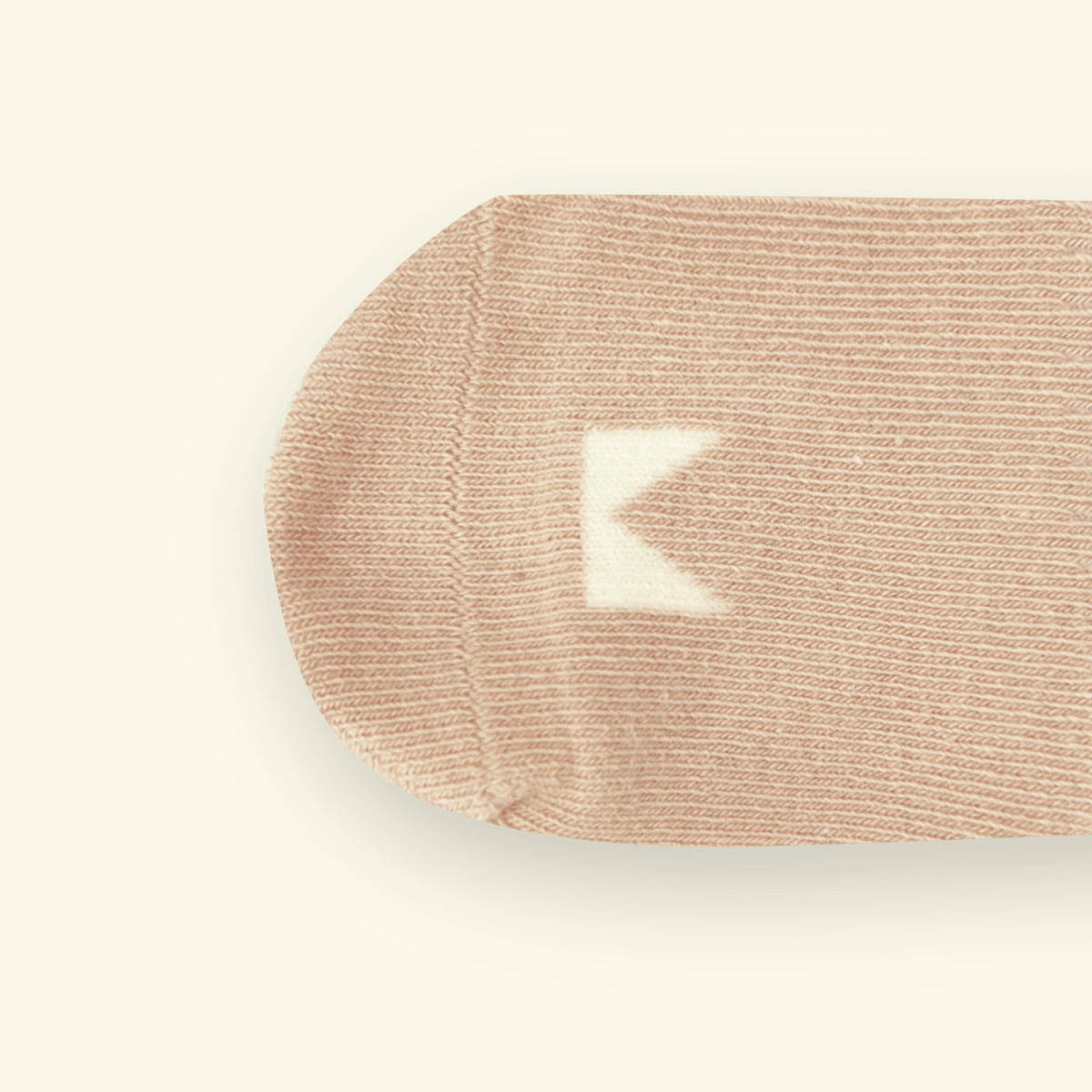 Organic Cotton Baby Socks in Oatmeal color, soft and snug for little feet, featuring Mosey logo above toes.