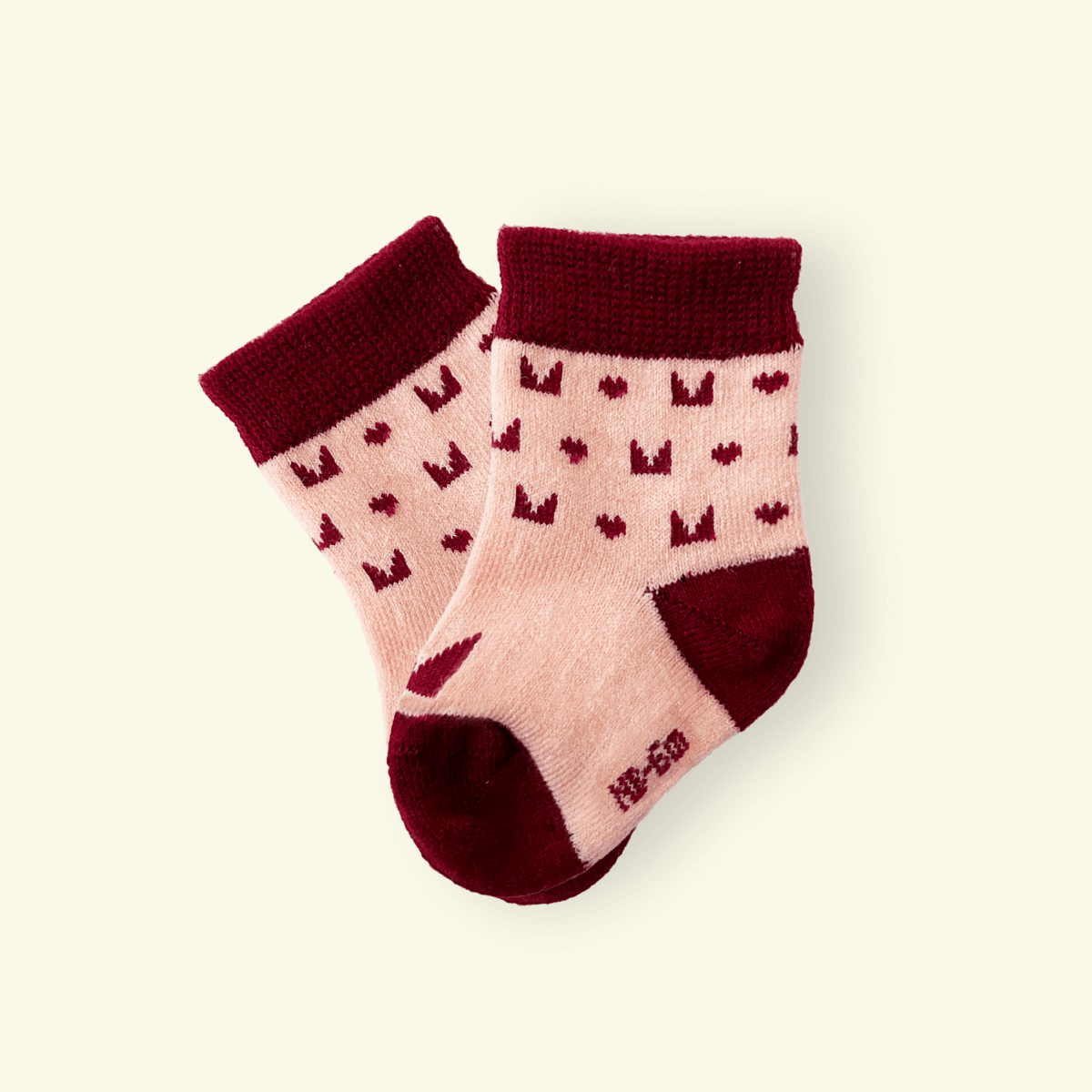 Merino Wool Baby Socks in Plum with logo pattern, cozy and designed for comfort in every step.