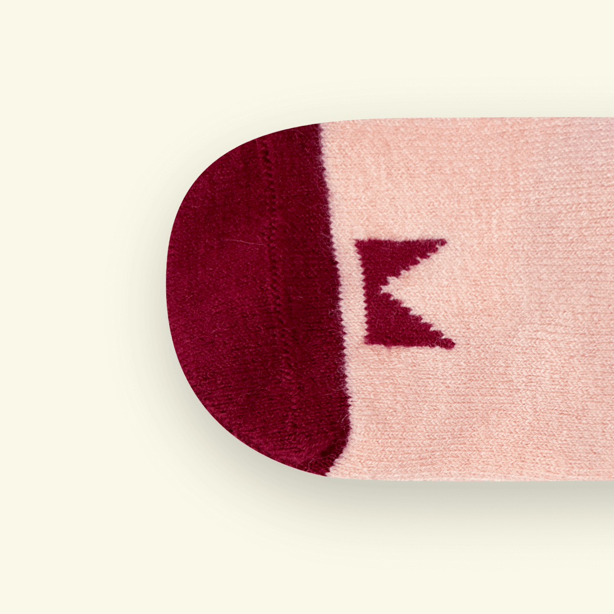 Close-up of the toe design on Merino Wool Baby Socks in Plum with Mosey logo pattern.