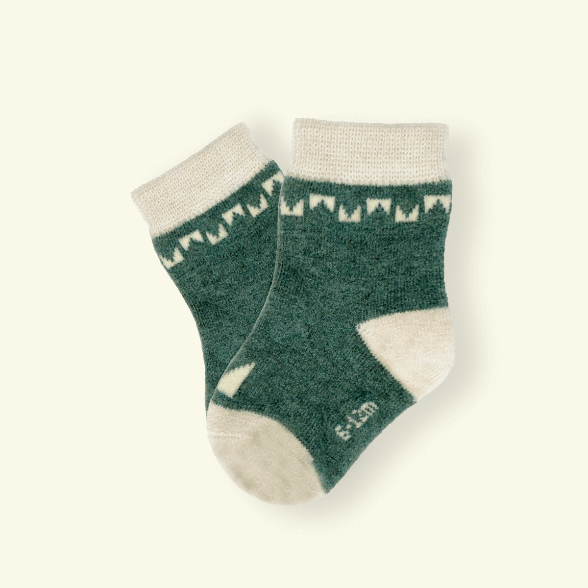 Merino Wool Baby Socks in green and cream color from Mosey, featuring a modern pattern and cozy fit.