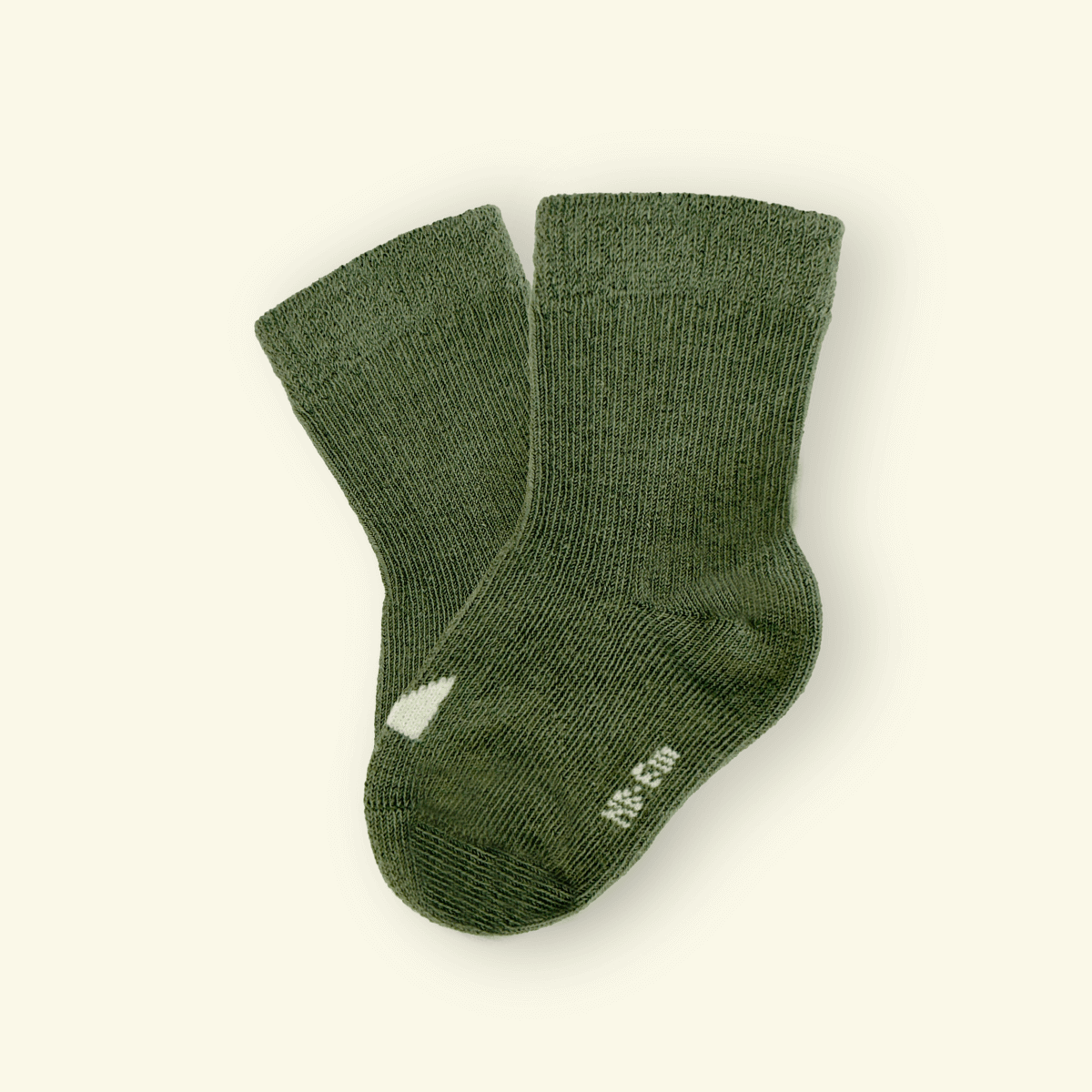 Organic Cotton Baby Socks in sage green color, perfect for keeping tiny feet cozy and comfy during little adventures.