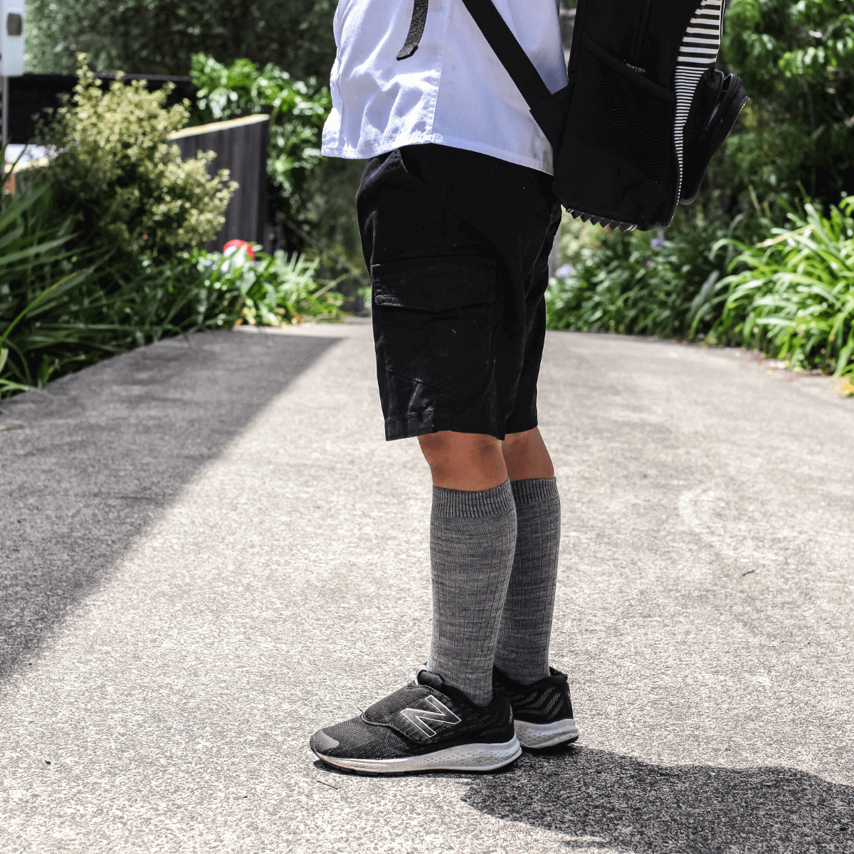 child wearing grey knee-high merino wool socks school aus