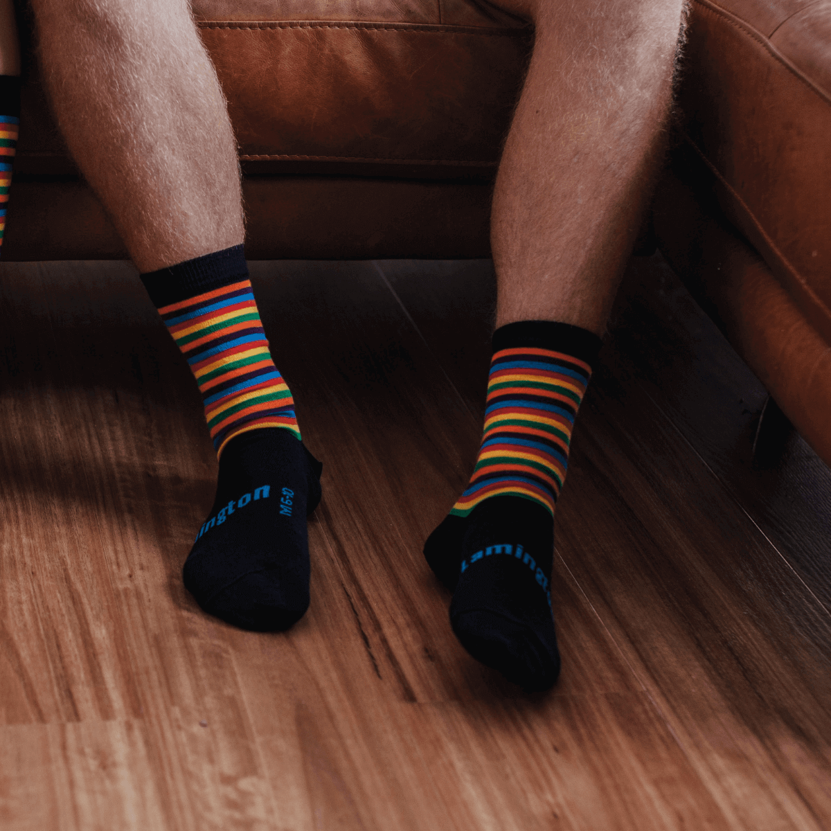 man wearing merino wool crew socks rainbow stripes aus